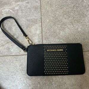 Black and gold Michael, by Michael Kors wristlet